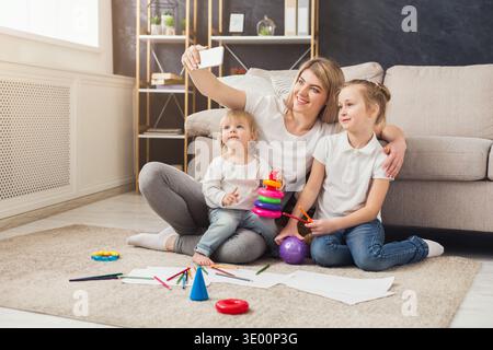 Happy mother spending time with her daughters Stock Photo
