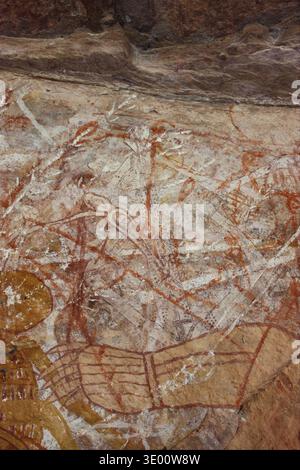 Aboriginal rock art depicts figures of Mimi Spirits on a cave wall ...