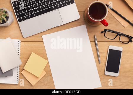Wooden table with empty paper top view Stock Photo