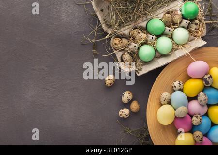 Easter background. Colored eggs on gray stone surface Stock Photo