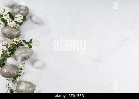 Easter eggs floral border on light background Stock Photo