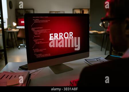 Caucasian Young Adult Man Observing Computer Screen Displaying Error Message Stock Photo