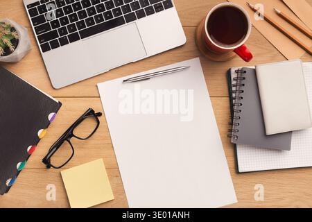 Wooden table with empty paper top view Stock Photo