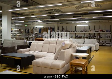 Pforzheim Germany March 9, 2026 Spacious Sofa Aisle With Neutral Sectionals And Plush Cushions, Varied Configurations From Chaise To Recliner, Soft Fa Stock Photo