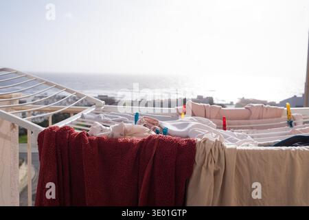 Laundry Drying on Balcony with Ocean View Stock Photo