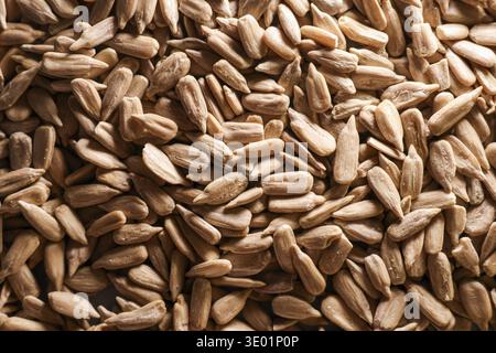 Sunflower seed kernels forming a full frame background, representing healthy eating, vegan food, and natural ingredients Stock Photo