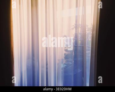 Curtains on window at sunset, furniture and design Stock Photo