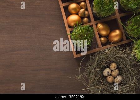 Easter golden eggs on wooden background Stock Photo