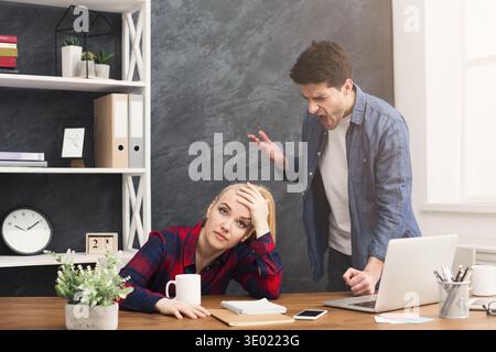 Emotional colleagues arguing at office Stock Photo