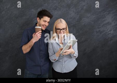 Business partners discussing project on laptop Stock Photo