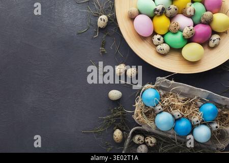 Easter background. Colored eggs on gray stone surface Stock Photo
