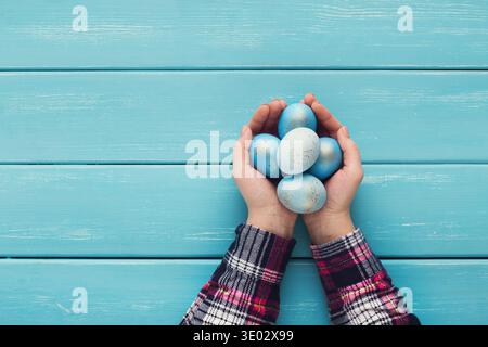 Female hand holding Easter eggs in hands Stock Photo