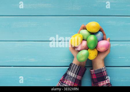 Female hand holding Easter eggs in hands Stock Photo