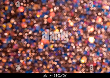 Background with many bright lights with bokeh effect and soft shades of blue, yellow, and red. Stock Photo