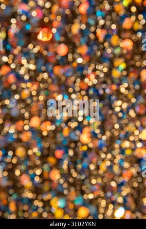 Colorful sparkles that create a sparkling bokeh light effect, ideal for festive backgrounds. Stock Photo