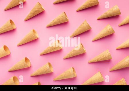 Empty wafer ice cream cones on pink background Stock Photo
