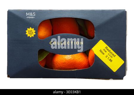 reduced food yellow sticker on box of Easy Peelers with leaves from M&S isolated on white background Stock Photo