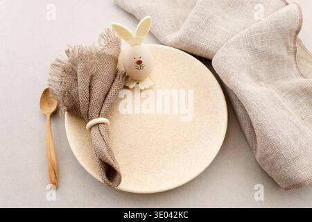 Zero waste Easter. Easter table setting with bunny egg decoration and linen napkin Stock Photo