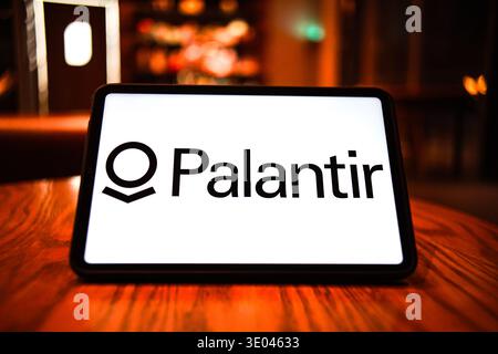 In this photo illustration, the logo of Palantir Technologies is displayed on the screen of a smart tablet. Stock Photo