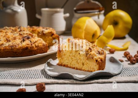 Indulge in this delicious apple crumble cake, expertly crafted and topped with crunchy hazelnuts. The perfect blend of sweet apples and nuts for any d Stock Photo