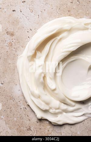 A close-up image showcasing the smooth, luscious texture of a beauty cream, emphasizing its creamy richness and luxurious quality, suitable for skinca Stock Photo