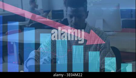 Working focused man wearing checkered shirt typing on keyboard at office, with red downward arrow Stock Photo
