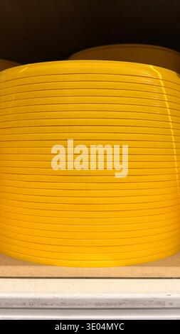 Yellow ribbed plastic surface. Abstract industrial background with horizontal lines. Stock Photo