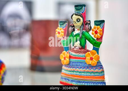A vibrant close-up shot of a traditional Mexican Catrina figurine, a decorative skeleton figure associated with the Day of the Dead (DÃ­a de los... Stock Photo