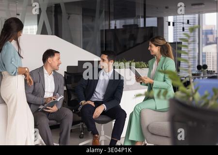 Multiethnic diverse group corporate executives meeting in office for discussion Stock Photo