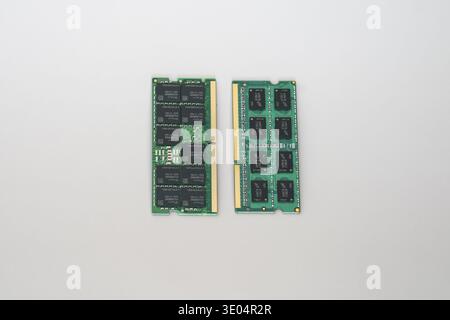 Two computer memory modules, one DDR5 ECC and one DDR3, displayed against a clean white background for comparison. Stock Photo