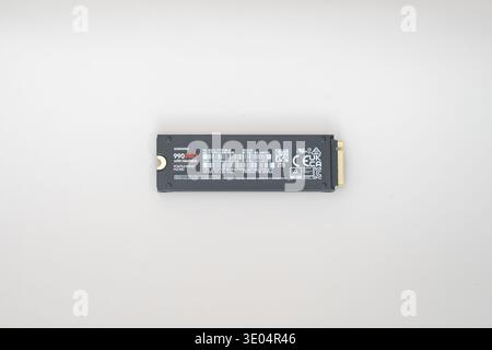 High-performance Samsung 990 PRO NVMe SSD with integrated heatsink, 2TB storage, PCIe 4.0 interface, displayed against clean white backdrop for tech a Stock Photo