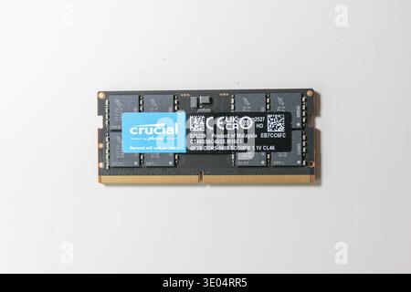 Close-up of a Crucial by Micron 48GB DDR5-5600 SODIMM memory module with product label and technical specifications, isolated on white.123343453465465 Stock Photo