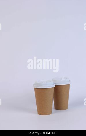 two brown cardboard glasses on a white background Stock Photo