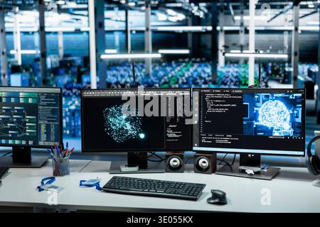 Machine learning software running on PCs in data center with rows of operational server racks. Computers using artificial intelligence tech in server hub built for digital storage systems Stock Photo