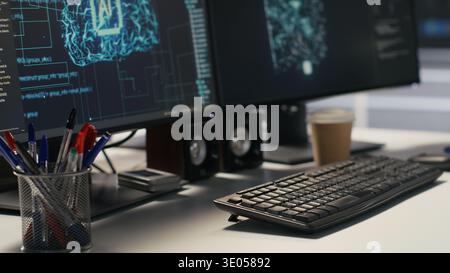 Data center PC screens displays monitoring backend infrastructure performance used in AI model development and automation workloads. Workstation monitors overseeing server hardware Stock Photo