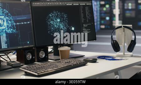 AI development workstation in data center with dual monitors displaying machine learning code. Server hub computers used for tracking neural network structures algorithm performance Stock Photo