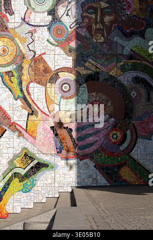 Detailed close-up of a vibrant multicolored mosaic tile mural featuring abstract artistic patterns and geometric shapes Stock Photo