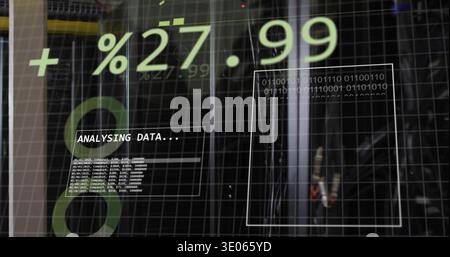Displaying data overlay on glass panel in server room, showing +%27 Stock Photo