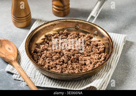 Homemade Grass Fed Sauteed Cooked Ground Beef in a Pan Stock Photo