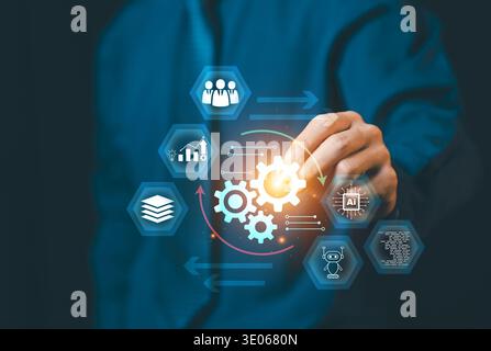 Businessman hand drawing business process with gears and AI icons. Concept of automation, workflow optimization, productivity and digital transformati Stock Photo