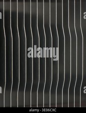 metallic cpu cooler heatsink fins full frame texture, vertical silver metal plates with smooth finish in repeating geometric pattern, closeup macro Stock Photo