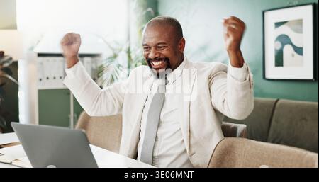 Happy, black man and winning with laptop for good news, bonus or promotion in office. Excited, businessman and computer with smile or fist pump for Stock Photo