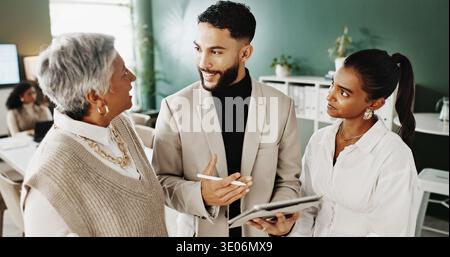 Fashion, review or team in office with tablet, style ideas or draft feedback in creative process. Collaboration, people or design manager with tech Stock Photo