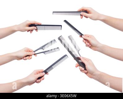 Female hands holding various combs isolated on white Stock Photo