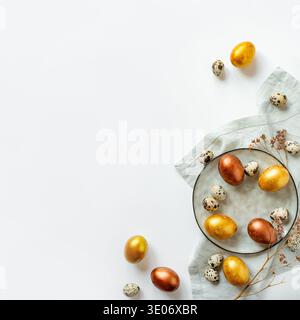 Golden and bronze Easter eggs in a grey plate Stock Photo