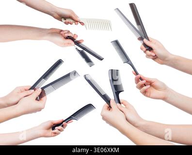 Female hands holding various combs isolated on white Stock Photo