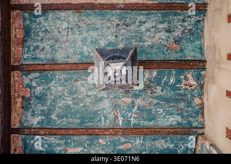 Ancient Ceiling With Peeling Blue Turquoise Paint On Brick Vaults And Rusty Iron Beams Stock Photo