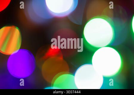 A blurry image of colorful lights in the sky. The colors are bright and vibrant, creating a sense of energy and excitement. Stock Photo