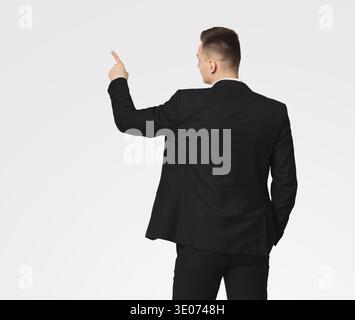 Businessman in suit working with digital virtual screen Stock Photo