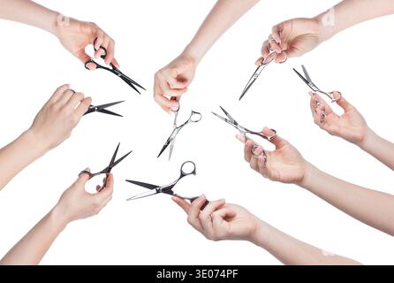 Hairdresser holding scissors in hand isolated on white background Stock Photo